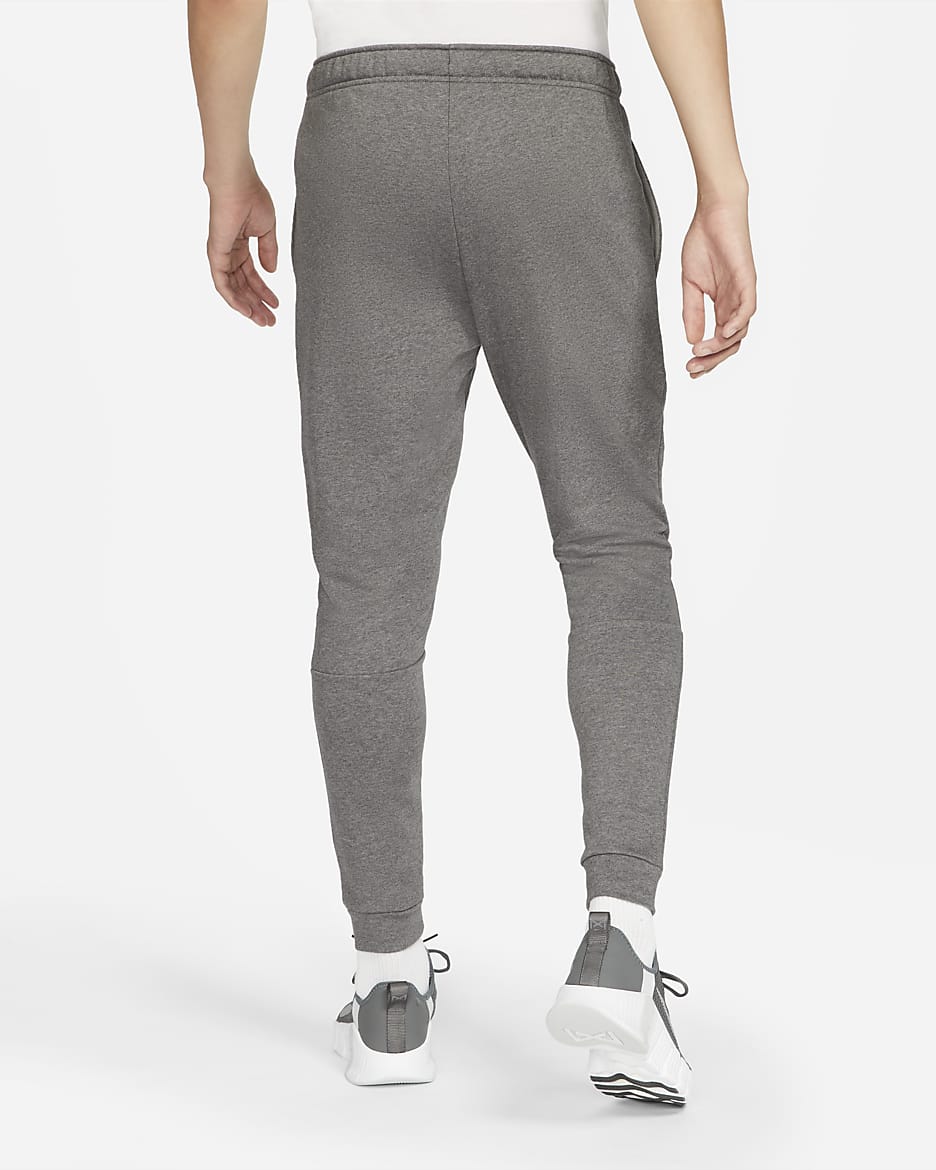 Pants de fitness de tejido Fleece Dri FIT entallados para hombre Nike Dry. Nike